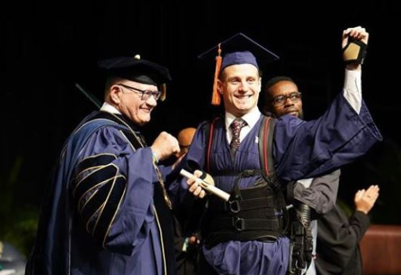 Aldo Amenta at his graduation, three years after a diving accident left him paralysed.