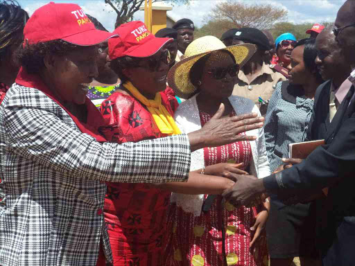 Mogotio MP Prof. Sambili (front) greets the public during jubilee women leaders caucus rally at Emining technical college grounds on Wednesday. She said she will retire after serving four terms. PHOTO/JOSEPH KANGOGO