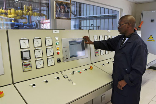 An employee monitors the engine room of a pilot power project in the Rwandan border town of Rubavu on May 2, 2014. File photo