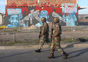 SANDF members patrol the Cape Flats in Cape Town, which recorded a slight drop in murders over the past weekend.