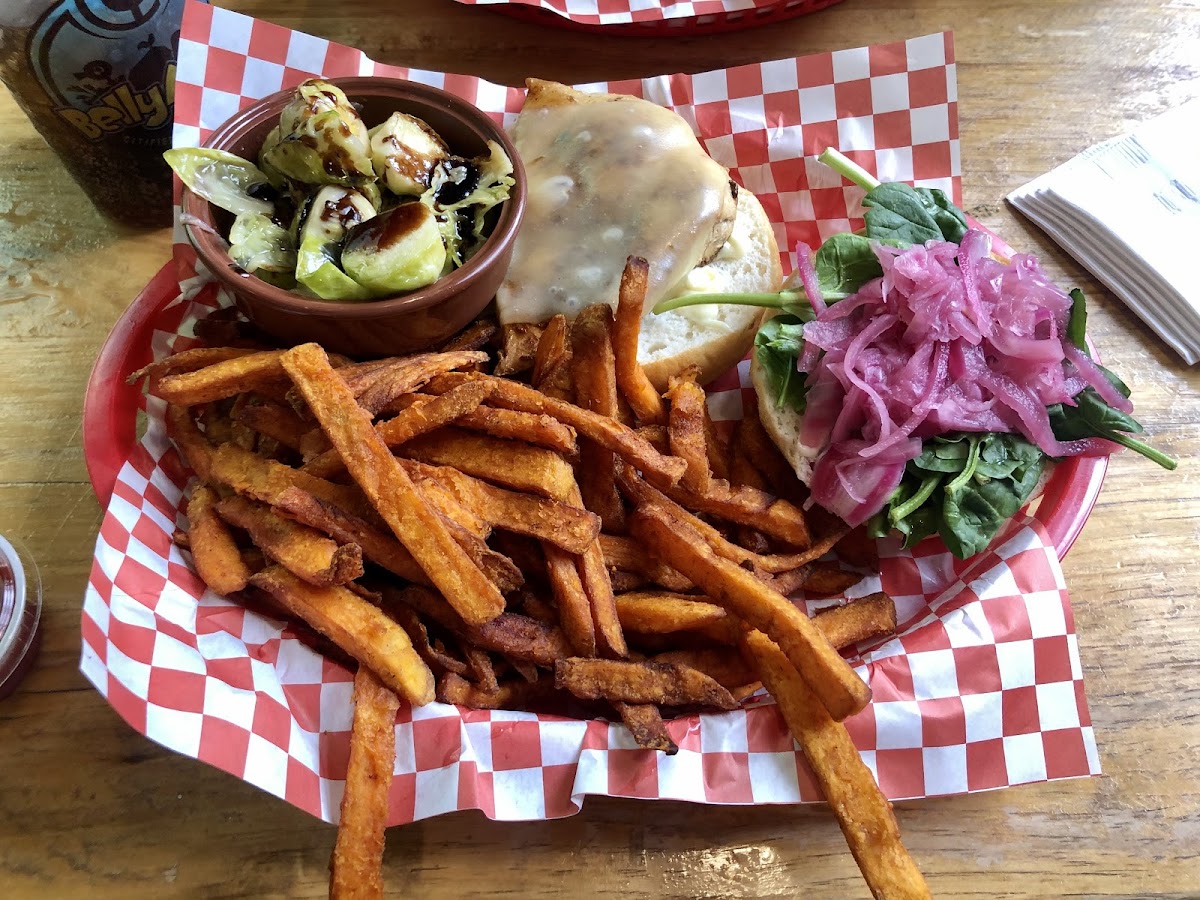 Over roasted chicken on gf bun, pickled onion, spinach, mayo, with sweet potato fries and balsamic brussel sprouts.