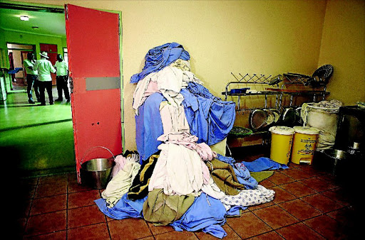 TERRIBLE SIGHT: Dirty linen, patients' gowns and bed pans are piled in a room near a passage at Zebediela Hospital in Limpopophoto: sandile ndlovu