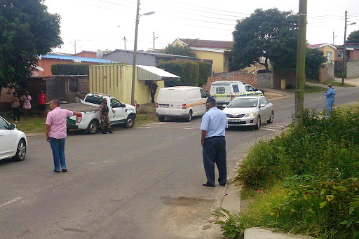 CRIME SCENE: Members of the SAPS at the scene where a vehicle carrying cigarettes was robbed in Vergenoeg yesterday Picture: MARK ANDREWS