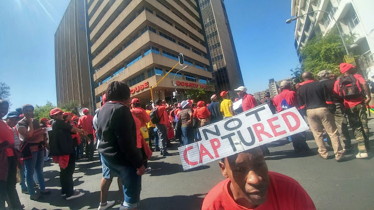 Members of Cosatu gather outside the Johannesburg office ahead of the national march against state capture on 27 September 2017.