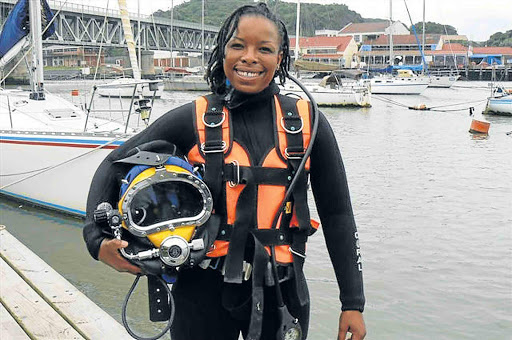 STEELY WILL: East London harbour diver Ratanang Maremane, 31, physically removed a car tyre jammed in the propeller of the tug Mpunzi on Monday and on Tuesday cleared away a large bag wrapped around the screw of the port’s pilot boat, Tristan Tern Picture: SUPPLIED