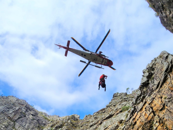 A helicopter was used to reach and extract the injured hikers.