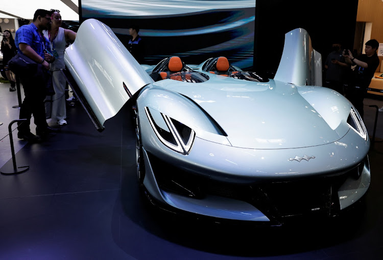 Visitors look at BYD's Fangchengbao Super 9 electric convertible concept vehicle displayed at the Beijing International Automotive Exhibition, or Auto China 2024, in Beijing, China, on April 25, 2024. Picture: REUTERS/TINGSHU WANG