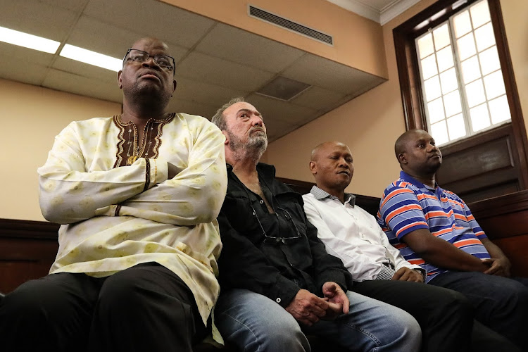 Mangope France Hlakudi, Antonio Jose Da Costa Trindade, Abram Abei Masango and Maphoko Hudson Kgomoeswana appear at the Johannesburg magistrate's court for their formal bail application on December 19 2019.