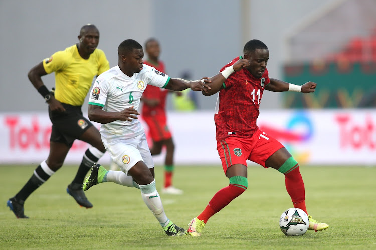 Nampalys Mendy of Senegal challenges Gabadinho Hellings Mhango of Malawi during the 2021 Africa Cup of Nations Afcon Finals football match between Malawi and Senegal at Kouekong Stadium in Bafoussam, Cameroon on 18 January 2022.