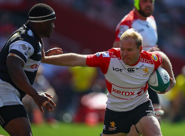 Ross Cronje (C) of the XEROX Golden Lions running with the ball during the Currie Cup match between Xerox Golden Lions XV and Cell C Sharks XV at Emirates Airline Park on August 18, 2019 in Johannesburg, South Africa.