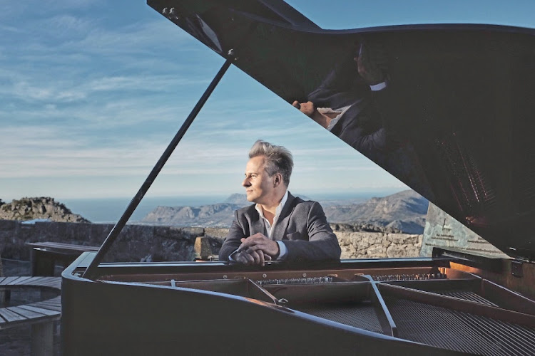 Charl du Plessis plays a Steinway piano on top of Table Mountain
