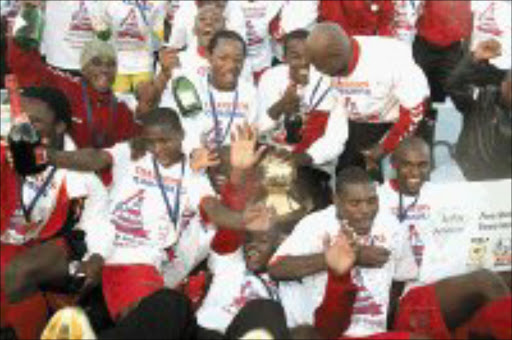 CELEBRATION TIME: Free State Stars players celebrate after being crowned the 2006-2007 Mvela Golden League Champions. Pic. Antonio Muchave. 28/04/07. © Sowetan.