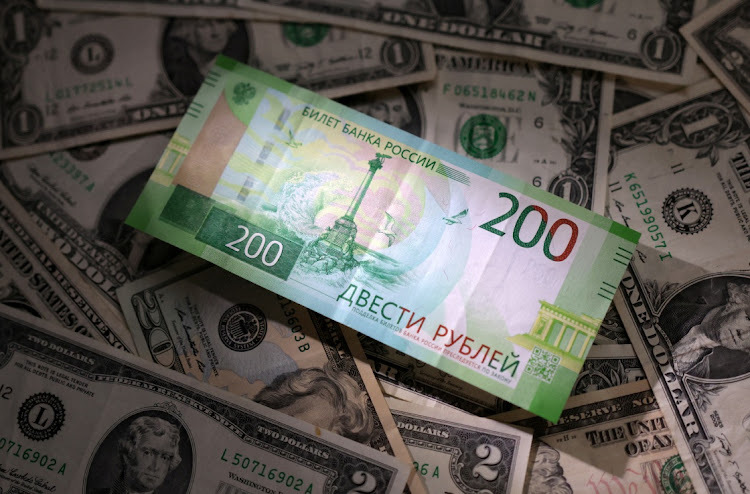 Russian Rouble and US dollar banknotes are seen in this illustration taken March 10 2023. Picture: REUTERS/DADO RUVIC