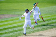 South Africa's Dean Elgar celebrates 100 runs during day one of the first Test cricket match between New Zealand and South Africa at the University Oval in Dunedin on March 8, 2017.
