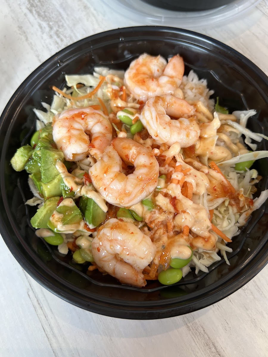 White rice, cabbage, carrot, edamame, avocado, spicy sweet chili shrimp with the sweet chili and PM sauces. So so good!