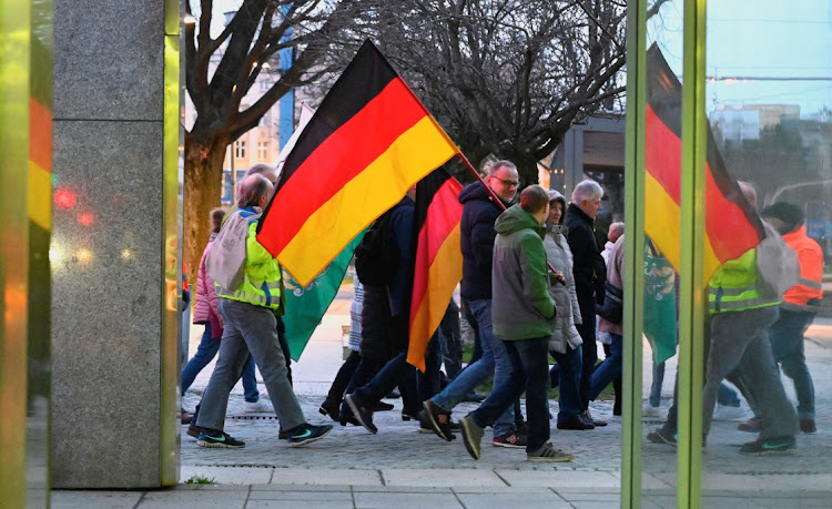 Protesters carry national flags of Germany and the ultra far-right party Freie Sachsen (Free Saxony) during a demonstration in Chemnitz, Germany, March 18 2024. Picture: REUTERS/Matthias Rietschel