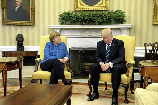 US President Donald Trump and German Chancellor Angela Merkel assume very different postures during their meeting in the White House on Friday.