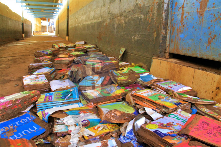 Smudged books outside a muddy classroom at Mathare North Primary School affected by floods, May 3, 2024.