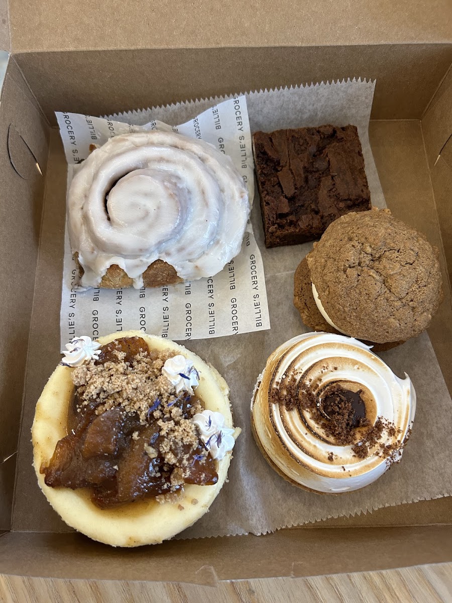 cinnamon roll, brownie, cream pie, peach cheesecake, and smores tart