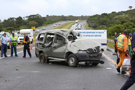 LIVES CUT SHORT: Police assess the scene of an accident on the N2 between the Gonubie and Beacon Bay off-ramps on Wednesday morning that killed two and injured five people Picture: STEPHANIE LLOYD