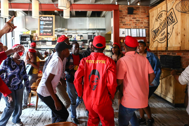 Members of the Economic Freedom Fighters protest inside the Smokehouse and Grill in Braamfontein, Johannesburg.