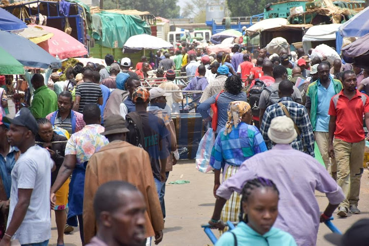 Kenyans carry on their daily activities prior to the 20222/23 budget reading at Gikomba market on April 7, 2022.