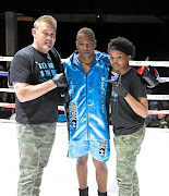 Seasoned boxing trainer Lionel Hunter and his assistant trainer 18-year-old Grade 11 student Tamrin Raynor with their charge Lebo Mashitoa after his win recently. 