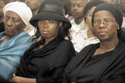 FAREWELL: Mandla Thabethe's wife Mapule Thabethe, middle, with her mother Hilda Mokgaotsane. Pic: Thuli Dlamini. 06/02/2010. © Sowetan.