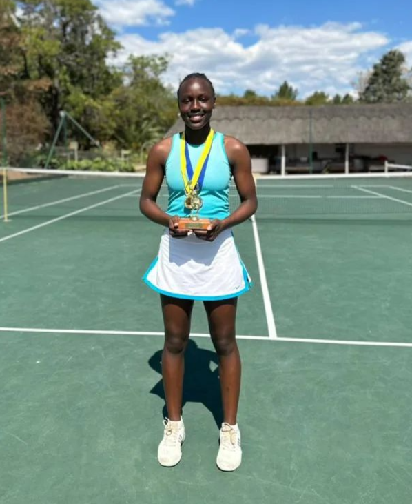 Melissa Mwakha with a trophy during a past tournament