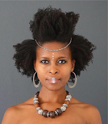 Botlhale Tshetlo, the owner of Hairtural Studio, a natural hair salon.