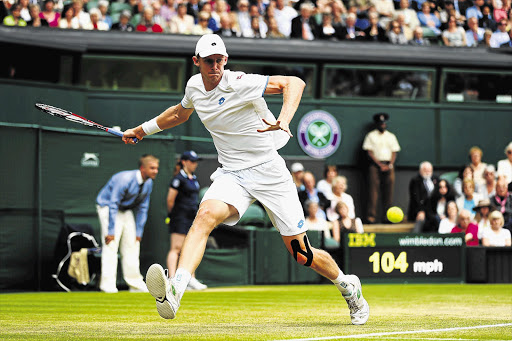 TOUGH GOING: Kevin Anderson of South Africa on the run in his men's singles fourth-round clash on Centre Court against Wimbledon champion Andy Murray yesterday. Anderson was given a tennis master class, going down in straight sets 6-4 6-3 7-6