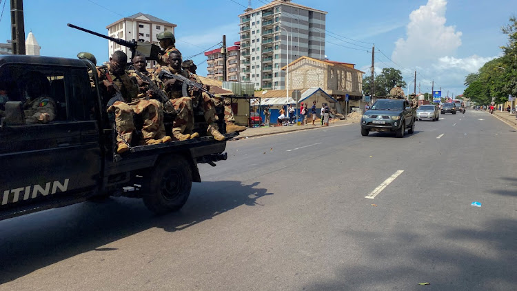 A convoy of Guinean security forces patrol a street, after former head of Guinea's 2008 military junta, Moussa Dadis Camara, was sprung from prison by heavily armed men in Conakry in the early hours of Saturday along with three other high-ranking officers, in Conakry, Guinea November 4, 2023.