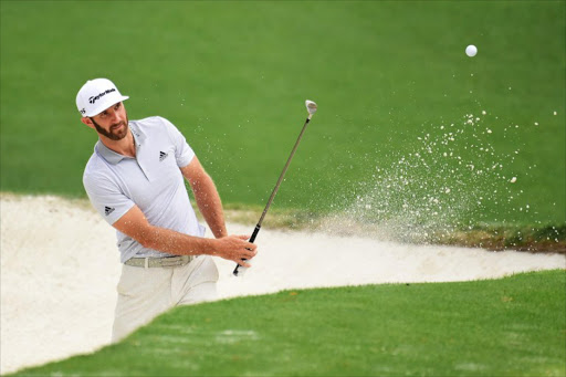 Dustin Johnson of the United States plays a shot from a bunker on the tenth hole during a practice round prior to the start of the 2017 Masters Tournament at Augusta National Golf Club on April 5, 2017 in Augusta, Georgia.