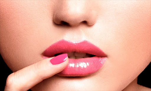 Pink lips and nails.