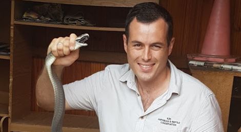 Snake removal expert Nick Evans with a black mamba he rescued in Durban. File pic