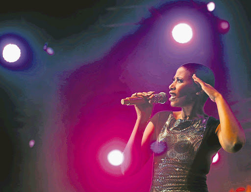 Zonke Dikana, seen here performing at the Cape Town Jazz Festival, says she's good at saving but also likes to live well