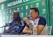 Free State Stars manager Rantsi Mokoena (L) says reports linking his head coach Luc Eymael (R) with the vacant coaching job at Kaizer Chiefs has affected his team in their last seven matches and added that it undermined his team. 
