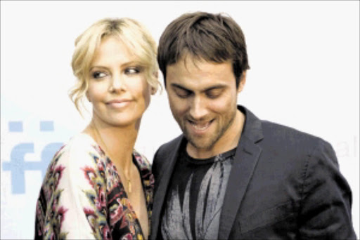 "Battle In Seattle" star Charlize Theron poses with boyfriend and writer/director Stuart Townsend on the red carped at the SIFF Opening Night Gala on May 22. The film merges dramatic performances with actual event footage to tell a semi-fictionalized story of the 1999 WTO riot in Seattle.