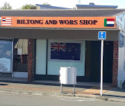 The owner of the Biltong and Wors Shop in Tawa, New Zealand, has replaced the old South African flag with that country's flag.