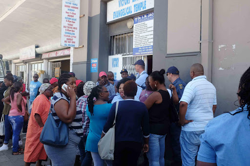 Chaos ensued outside Mzansi Trading Centre in Fleet Street when investors stormed the premises demanding their money back. Doors were broken and most of the office furniture was looted by the angry crowd before the police arrived. The owners of Mzantsi Trading Centre were no where to be found. PICTURE ALAN EASON