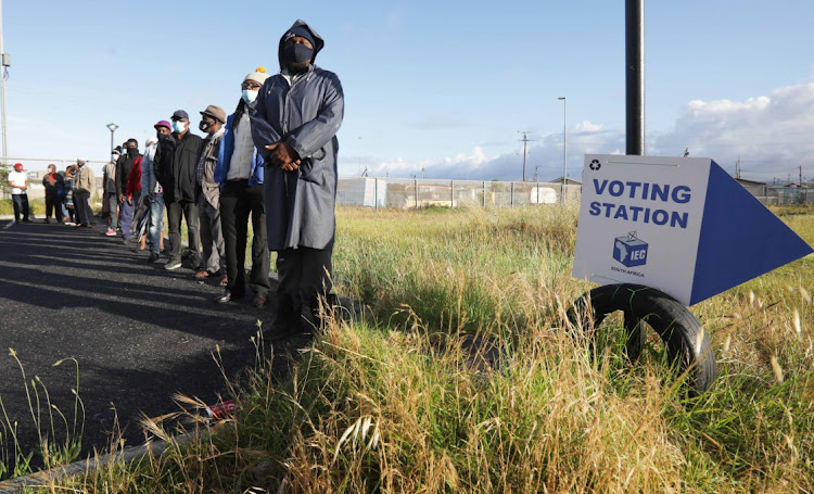 Voters queue in Khayelitsha to cast their vote during the 2021 local government election.