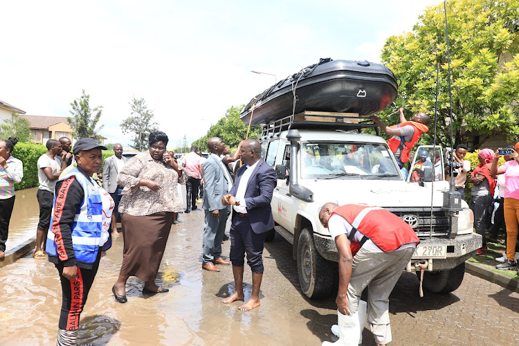 Personnel from the emergency response unit evacuate residents from a flooded residential estate in Athi River, Machakos on April 24, 2024.