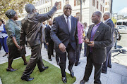 NENE MOMENT: Finance Minister Nhlanhla Nene arriving at parliament yesterday to deliver his first Budget speech. From April 1 many middle- and higher-income earners will take home slimmer pay packets - he has increased personal income tax for the first time since the 1990s