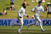 Dane Piedt and Proteas skipper Neil Brand celebrate the wicket of Will Young in Hamilton on Wednesday.