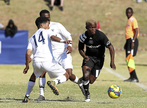 Lehlohonolo Sepeng of Orlando Pirates is challenged by Keenan Phillips of Bidvest Wits in their match last year.