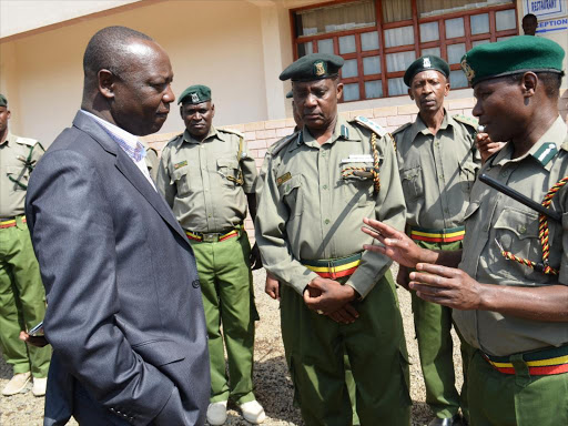 A file photo of Prisons commissioner general Isaiah Osugo (left) chatting with officer in charge of Narok prison Alfred Musila (centre) and Rift-Valley Provincial prisons Commander John Nkiria(right) /KIPLANG’AT KIRUI.