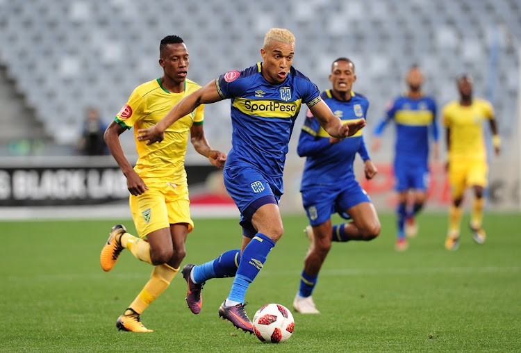 Matthew Rusike of Cape Town City pulls away from Divine Lunga of Lamontville Golden Arrows during the Absa Premiership match at Cape Town Stadium on August 18 2018.