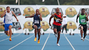 Akani Simbine, second from right, on his way to winning the 100m at the national championships in Pietermaritzburg on Friday. Simbine clocked 10.01 with Bayanda Walaza, second from left, second in 10.27 and Bradley Nkoana, right, was third in 10.29. Abduraghmaan Karriem was fourth in 10.32. 