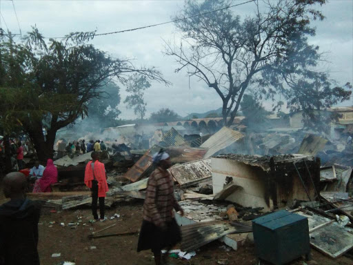 Residents at Homa Bay Town market where properties worth millions of shillings were destroyed by fire that began at midnight, May 27, 2017. /ROBERT OMOLLO