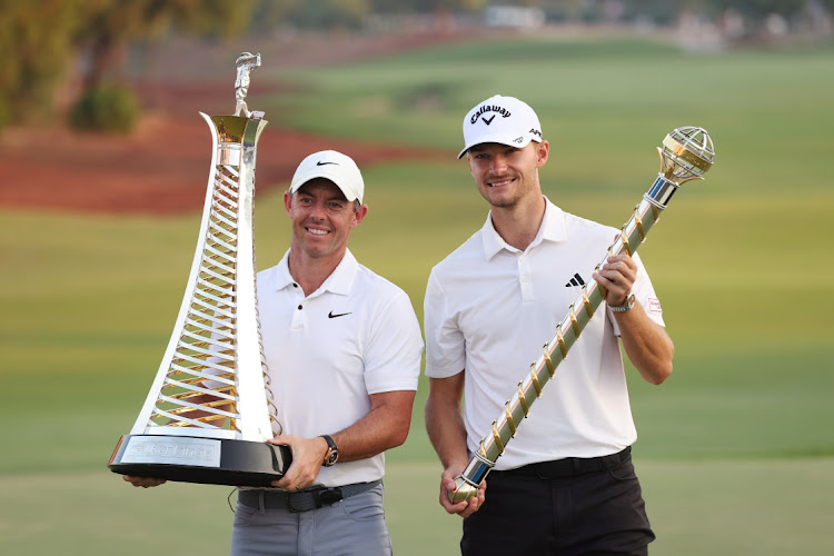 Race to Dubai winner Rory McIlroy of Northern Ireland and DP World Tour Championship winner Nicolai Hojgaard of Denmark pose with their trophies at Jumeirah Golf Estates in Dubai, United Arab Emirates, November 19 2023. Picture: LUKE WALKER/GETTY IMAGES